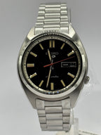 Seiko 5 Sports SNXS SRPK89K1, black dial with day-date and orange seconds hand