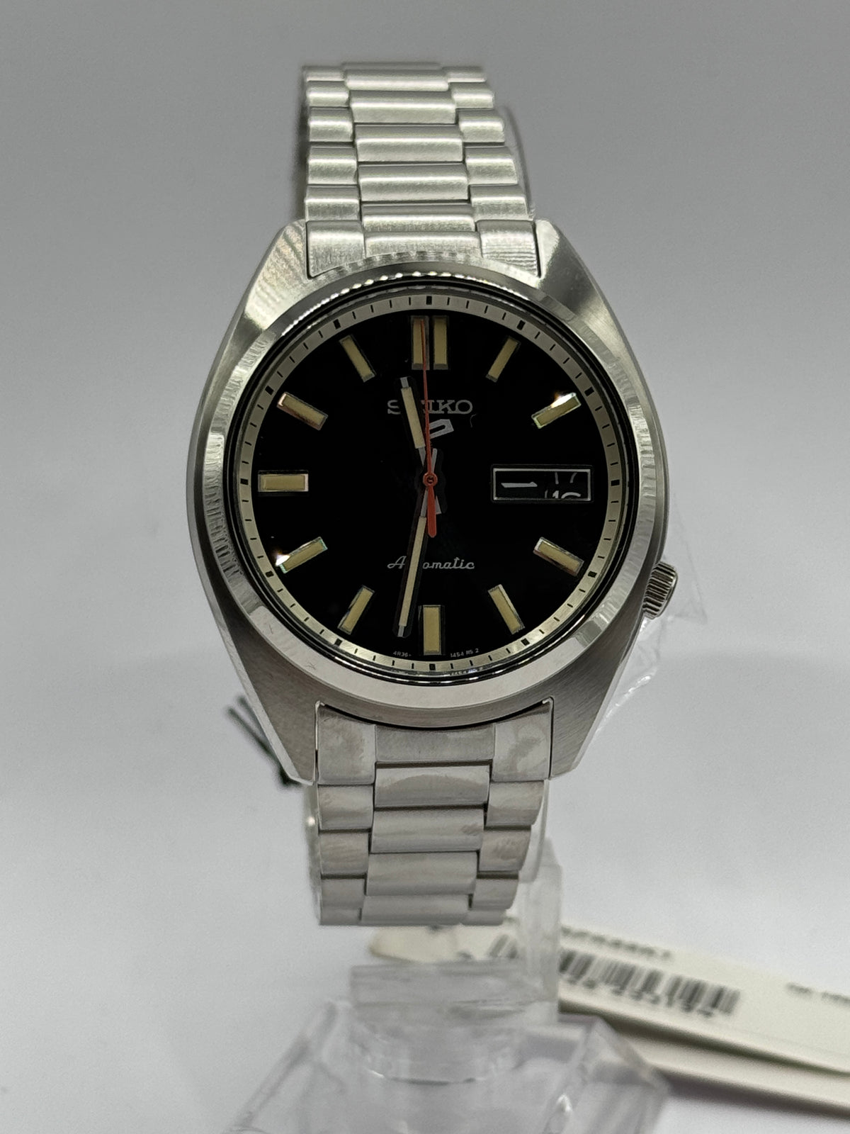 Seiko 5 Sports SNXS SRPK89K1, black dial and steel bracelet on stand