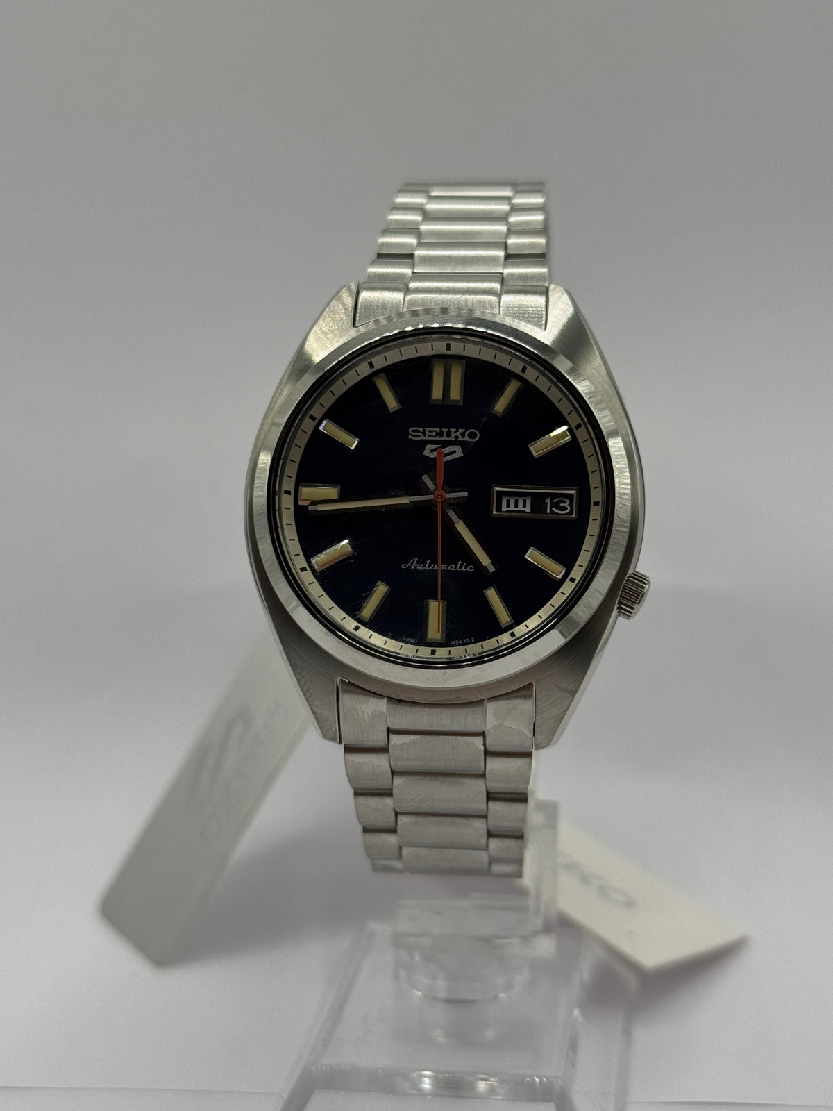 Seiko 5 Sports SNXS SRPK87K1 on stand, front view