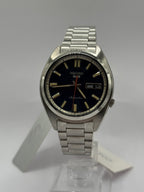 Seiko 5 Sports SNXS SRPK87K1 on stand with steel bracelet