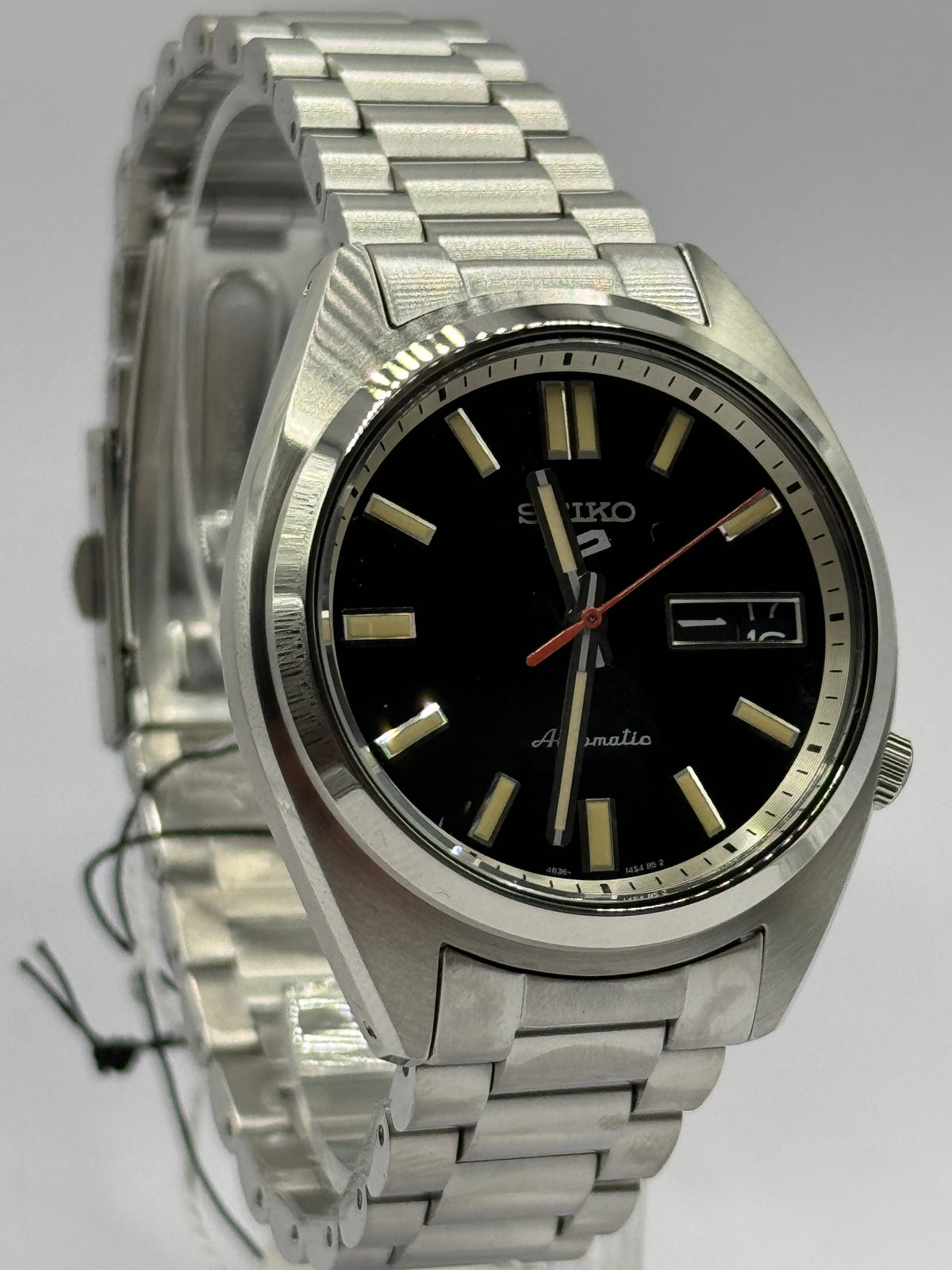 Seiko 5 Sports SNXS SRPK89K1, black dial at an angle