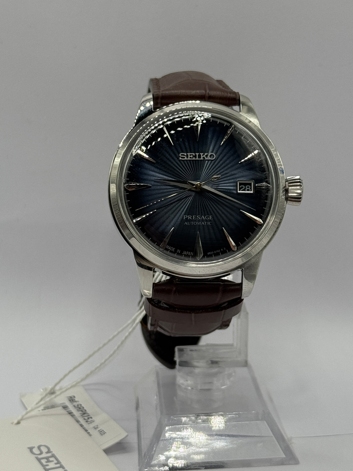 Seiko Presage Midnight Blue Moon SRPK15J1, blue sunburst dial and brown leather strap - front view
