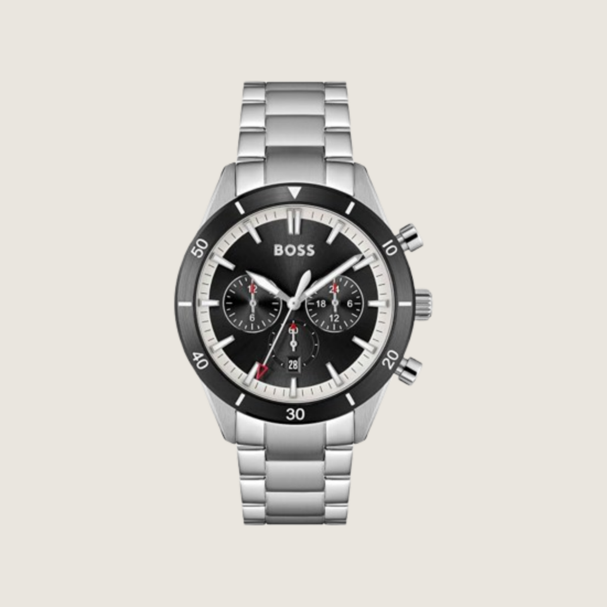 Hugo BOSS chronograph with black dial, red accents, black bezel and stainless steel bracelet, on a plain bone background