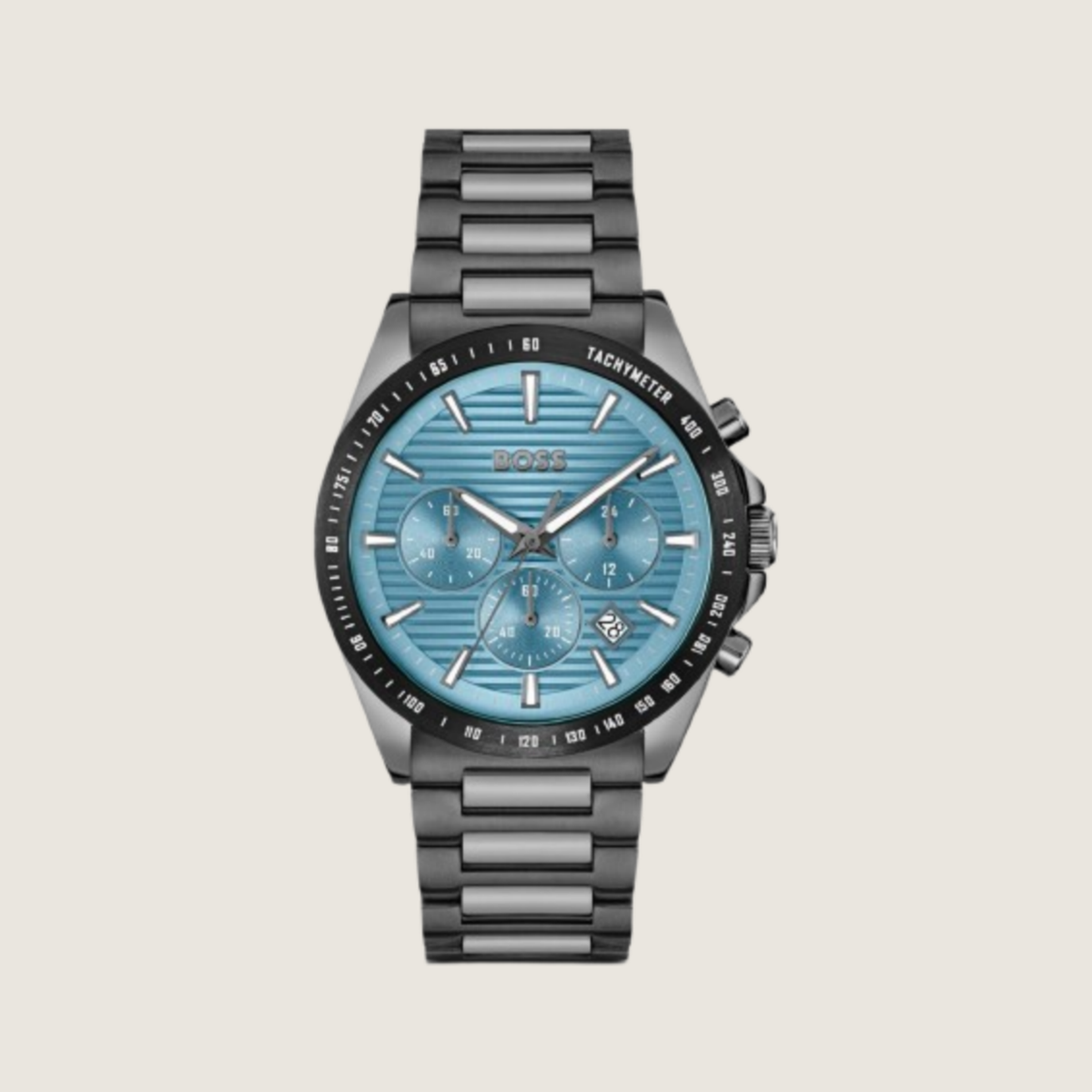 Hugo BOSS chronograph with pale blue tachymeter dial and dark gunmetal bracelet, on a plain bone background