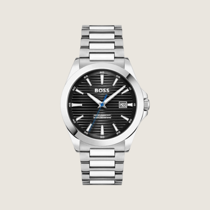 Hugo BOSS watch with black linear-textured dial, blue seconds hand and stainless steel bracelet, on a plain bone background