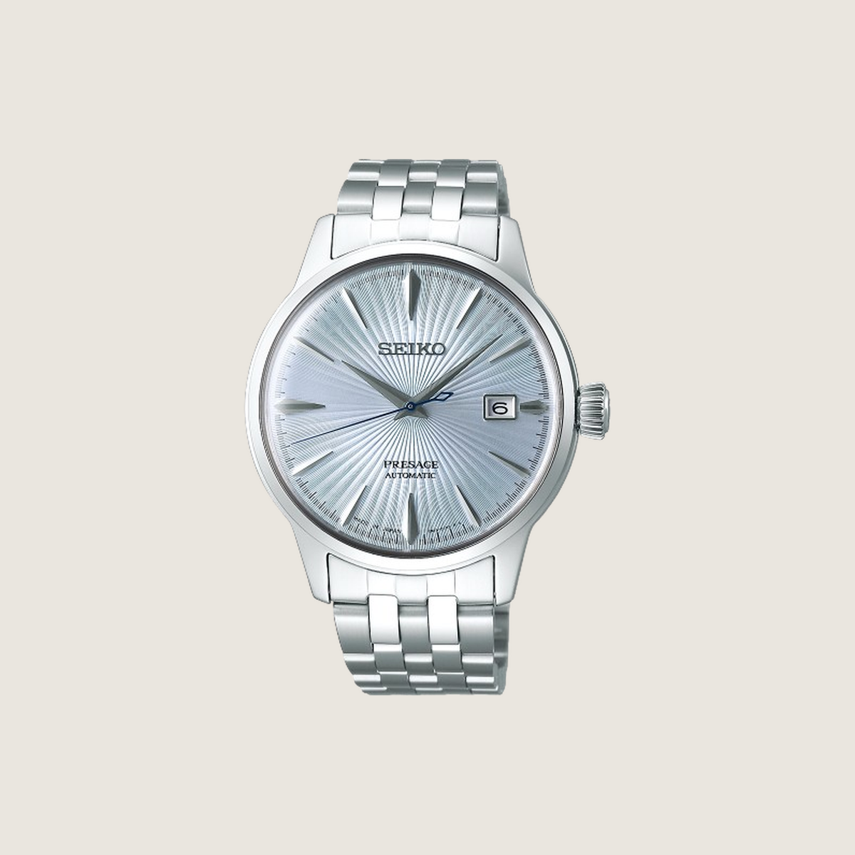 Seiko Presage Skydiving, ice blue sunburst dial and steel bracelet, on a plain bone background