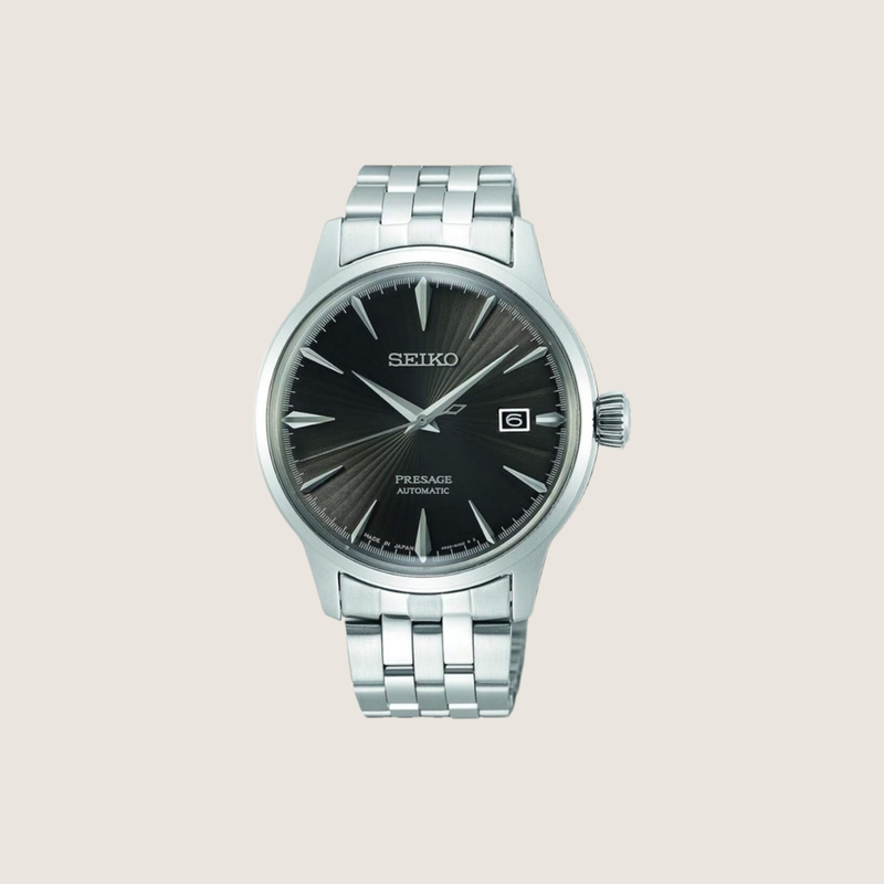 Seiko Presage Cocktail Time SRPE17J1, black dial and steel bracelet, on a plain bone background